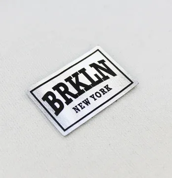Нашивка "BRKLN" 60*40 мм срібного кольору