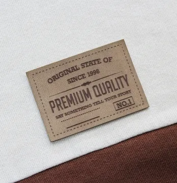 Нашивка "Premium quality" 60*42 мм пісочного кольору