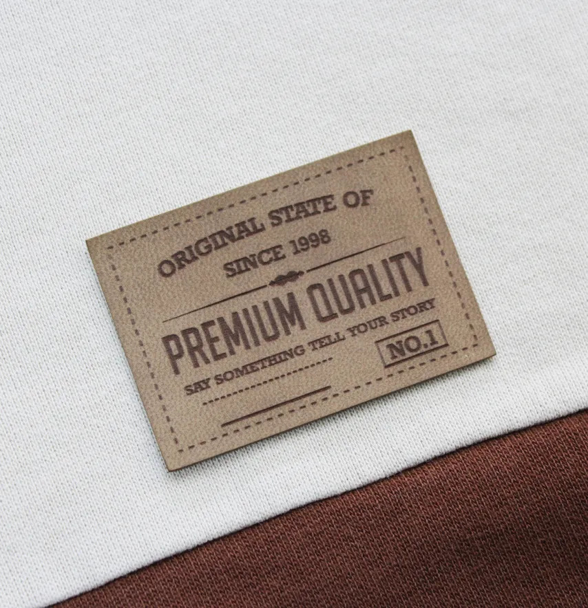 Нашивка "Premium quality" 60*42 мм пісочного кольору-0