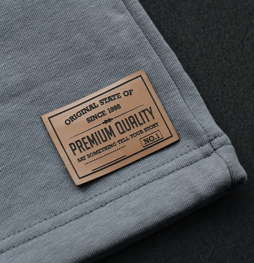 Нашивка "Premium quality" 60*42 мм світло-коричневого кольору-1