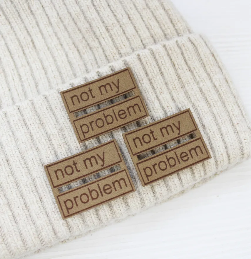 Нашивка "Not my problem" 60*45 мм пісочного кольору-1