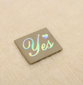 Нашивка "Yes" 20*25 мм бежевого цвета