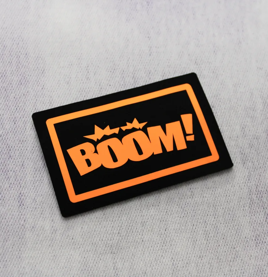 Нашивка "BOOM!" 80*50 мм чорного кольору з помаранчовим написом-1