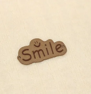 Нашивка "Smile" 40*20 мм пісочного кольору