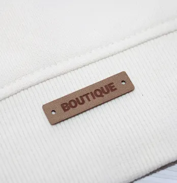 Нашивка "Boutique" 40*10 мм пісочного кольору
