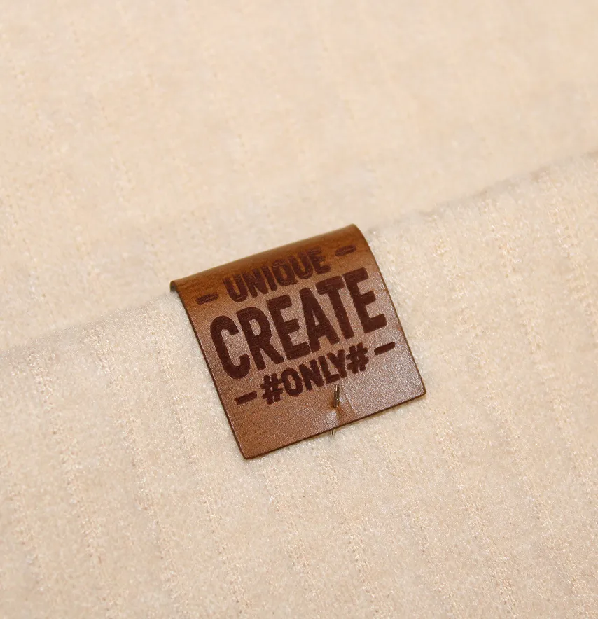 Нашивка "Unique create" 25*50 мм коричневого цвета-0