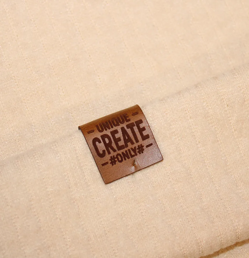Нашивка "Unique create" 25*50 мм коричневого цвета-1