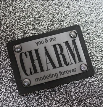 Нашивка "Charm" 70*50 мм чорного кольору