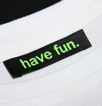 Бирка жаккардовая "Have fun" 50*12 мм черного цвета с зеленым лого