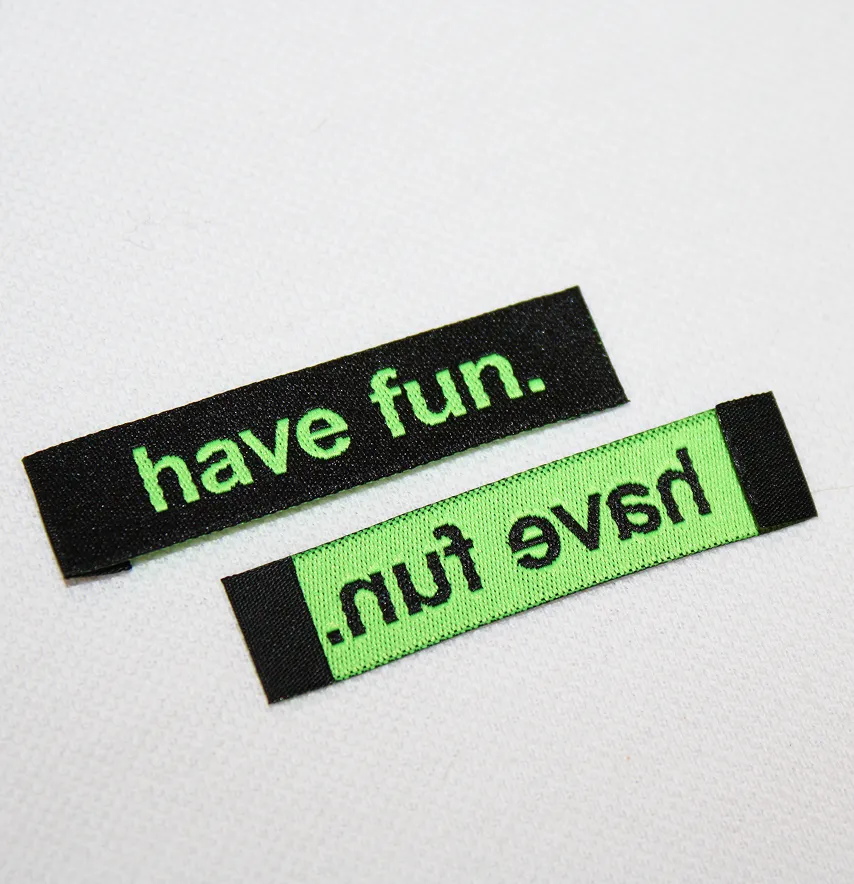 Бирка жакардова "Have fun" 50*12 мм чорного кольору з зеленим лого-1