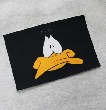 Нашивка тканева "Duffy Duck" 10*15 см чорного кольору