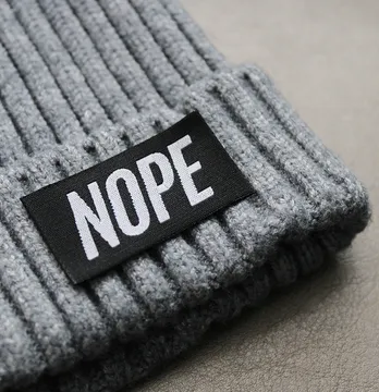 Бирка жакардовая "Nope" черного цвета 45*25 мм