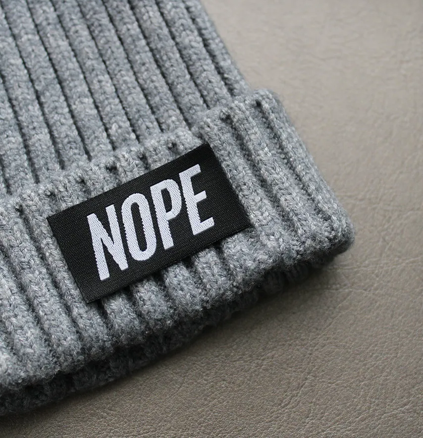Бирка жакардовая "Nope" черного цвета 45*25 мм-1