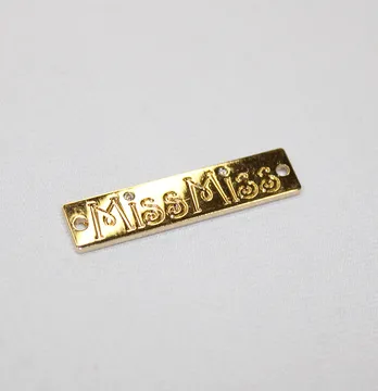 Лейба металлическая "Missmiss" длина 35*8 мм золото со стразами.