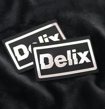 Нашивка "Delix" 60*40мм черного цвета с серебром