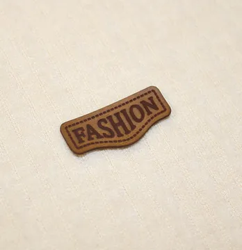Нашивка "Fashion" 40*18 мм коричневого кольору