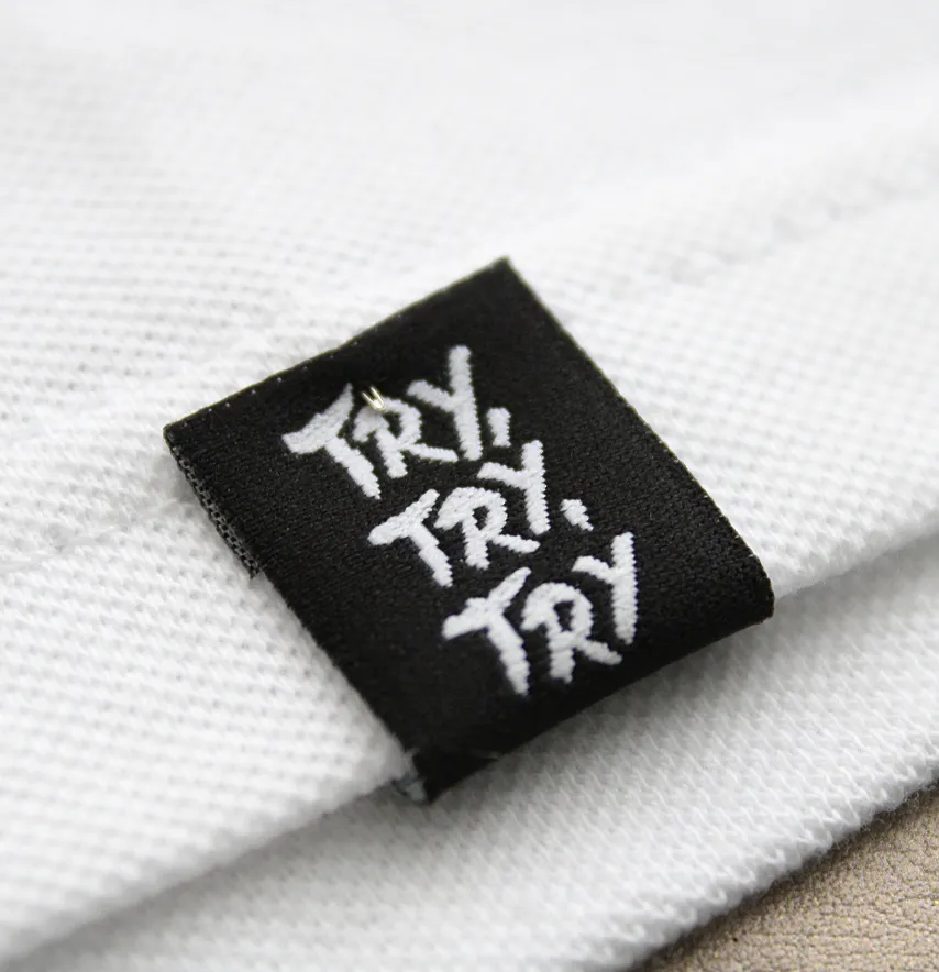 Бирка жаккардовая "Try,try,try" 20*45 мм черного цвета с белым лого-1