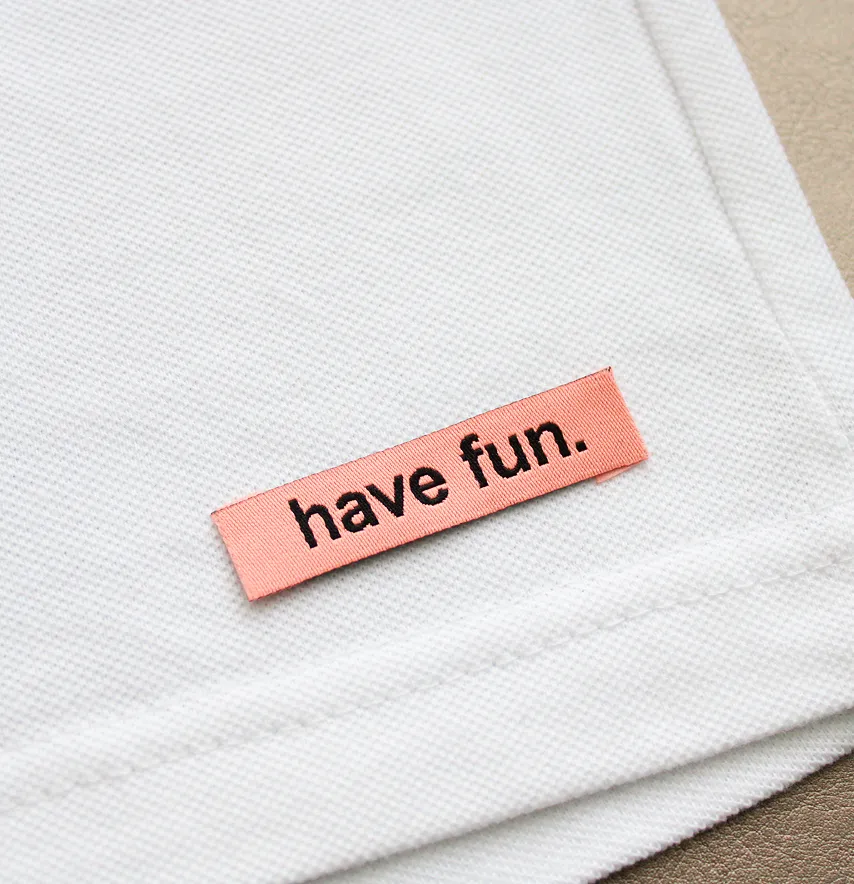 Бирка жаккардовая "Have fun" 50*12 мм персикового цвета с черным лого.-1