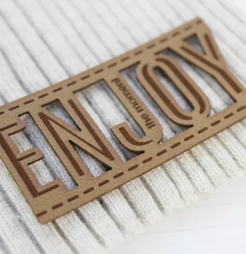 Нашивка "Enjoy" 60*30 мм пісочного кольору