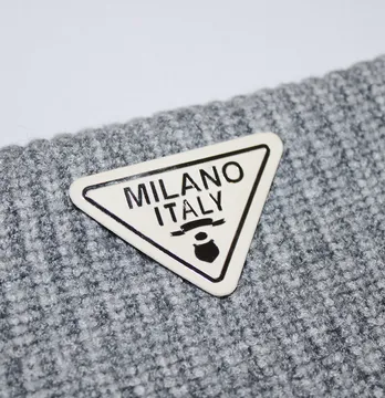 Нашивка "Milano" 50*35 мм білого кольору зі сріблом