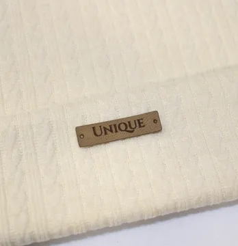 Нашивка "Unique" 40*10 мм пісочного кольору